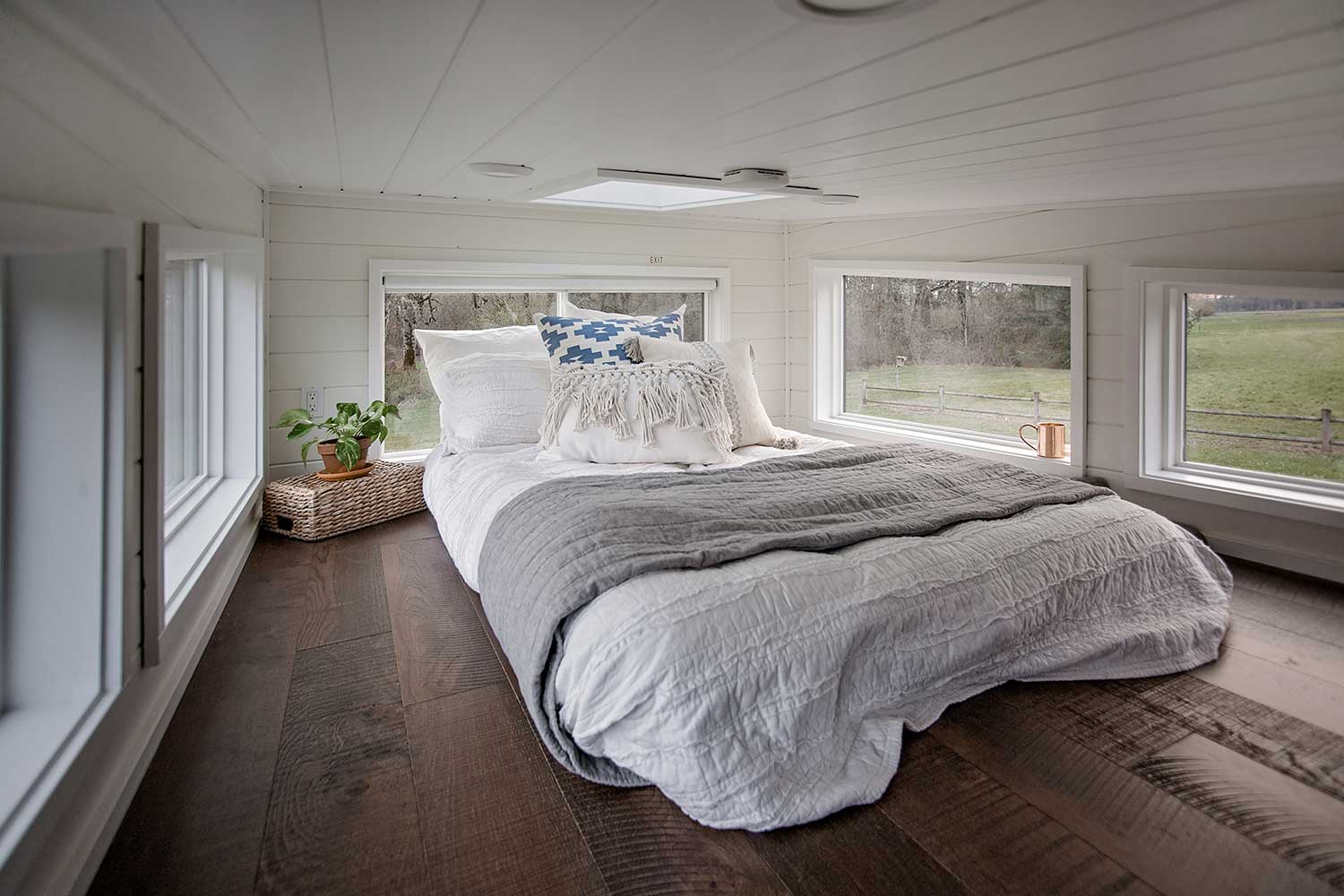 The Breezeway custom tiny home's loft bedroom