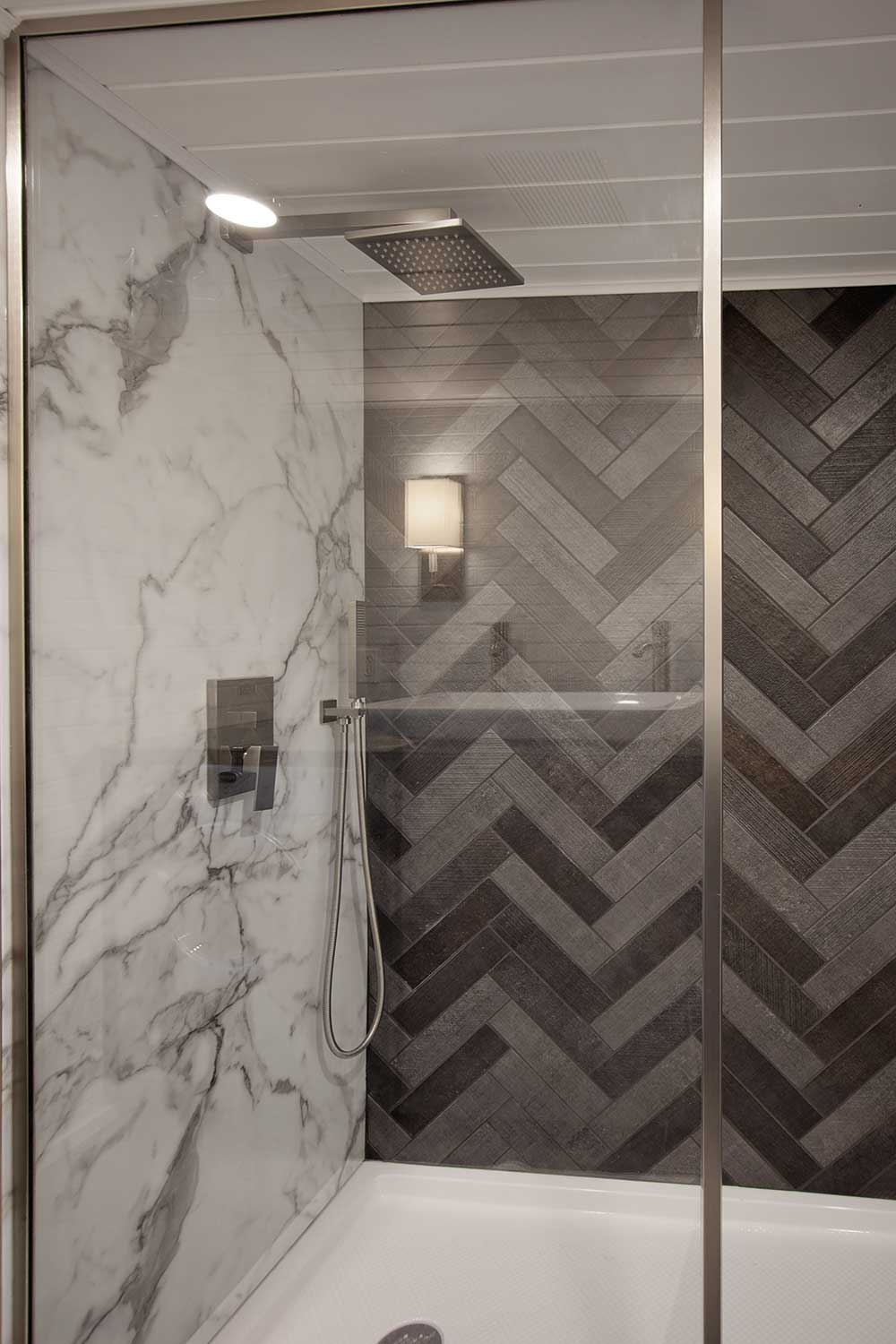 Tile and marble shower in the Breezeway custom tiny home