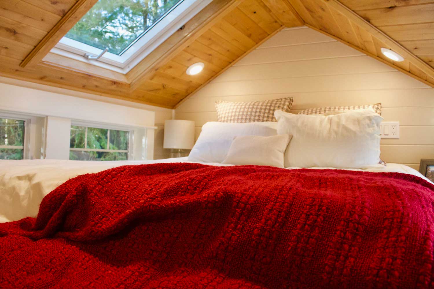 Loft bedroom with skylight in the Tiny Craftsman Home