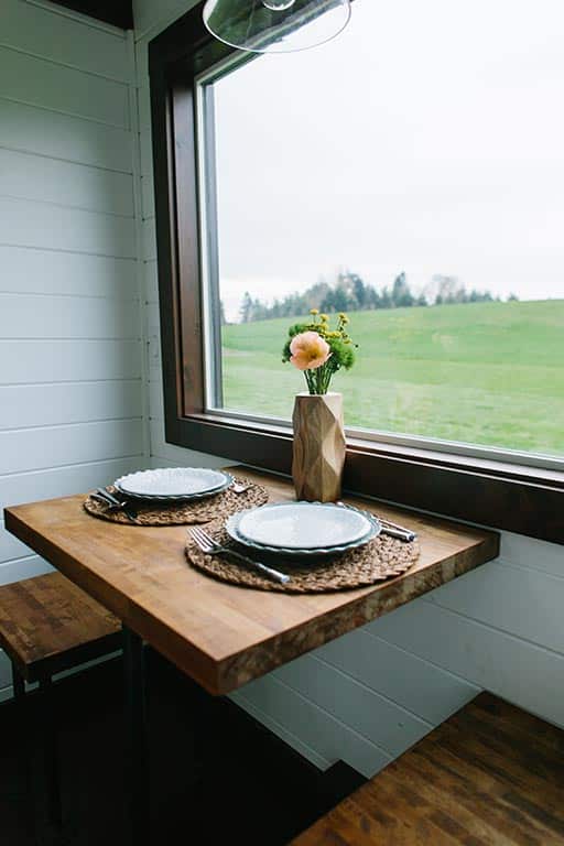 Dining table set for two in The Emerald custom tiny house