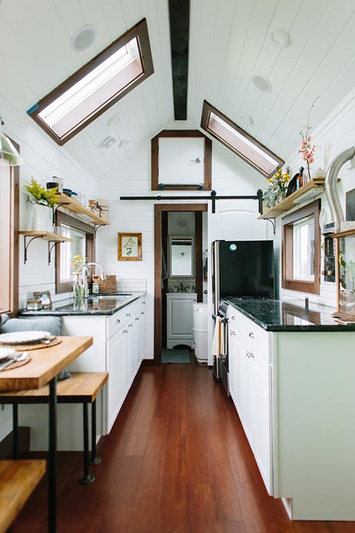 The Emerald custom tiny house's kitchen and eating area