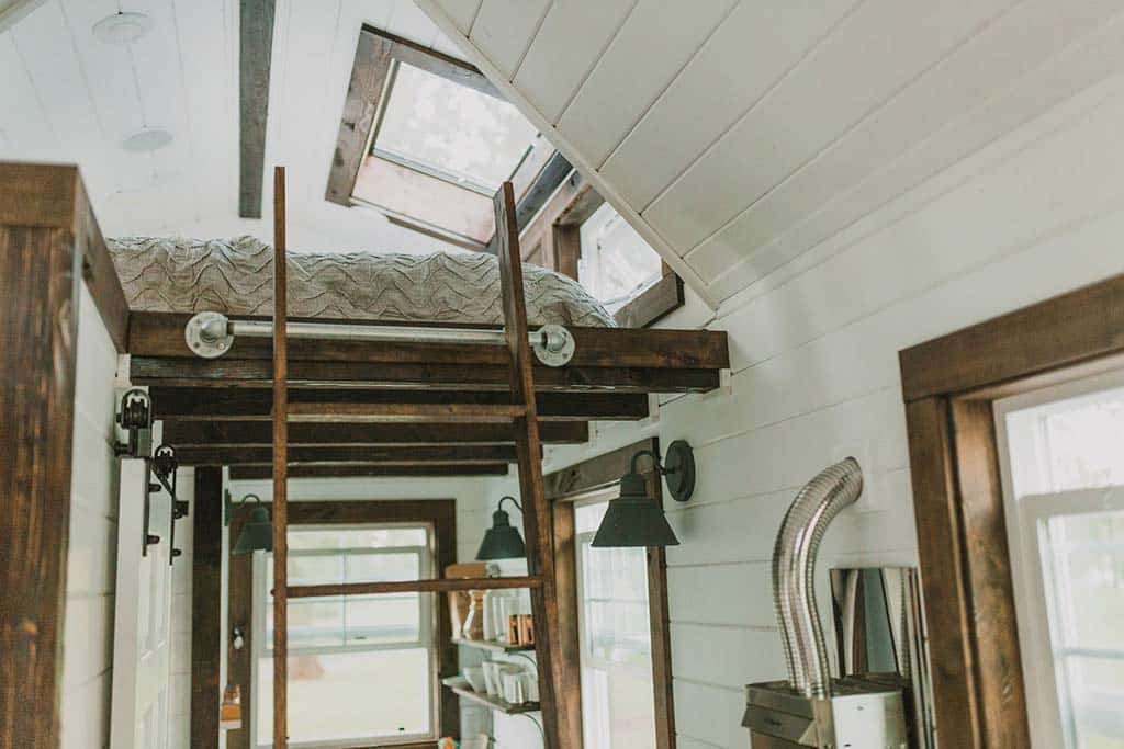 Ladder to loft in the Tiny Heirloom Genesis custom tiny house