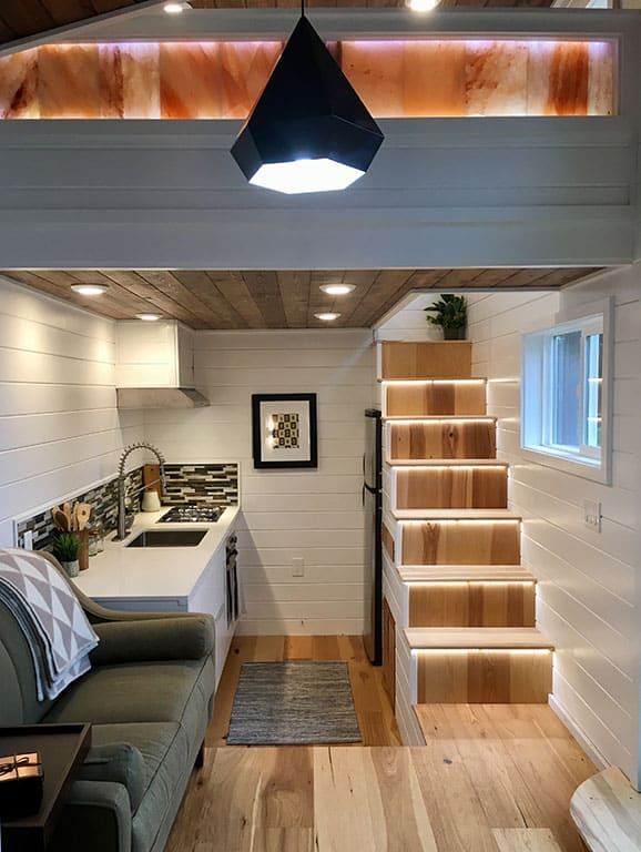 Kitchen and stairs to loft in the Home Of Zen custom tiny house