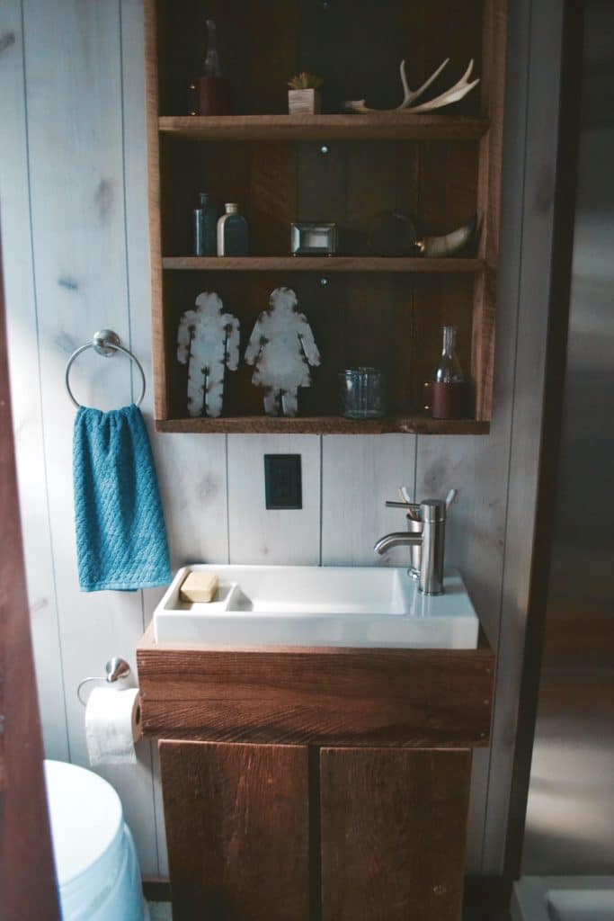 Bathroom sink in The Huntsman Cabin custom tiny home