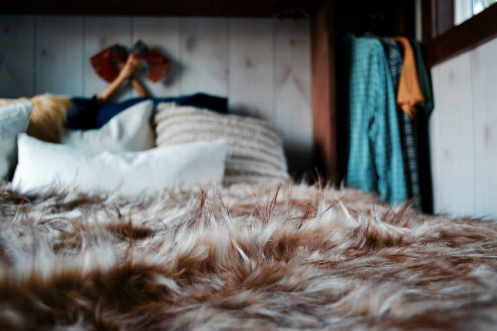 Bedroom of The Huntsman Cabin custom tiny home