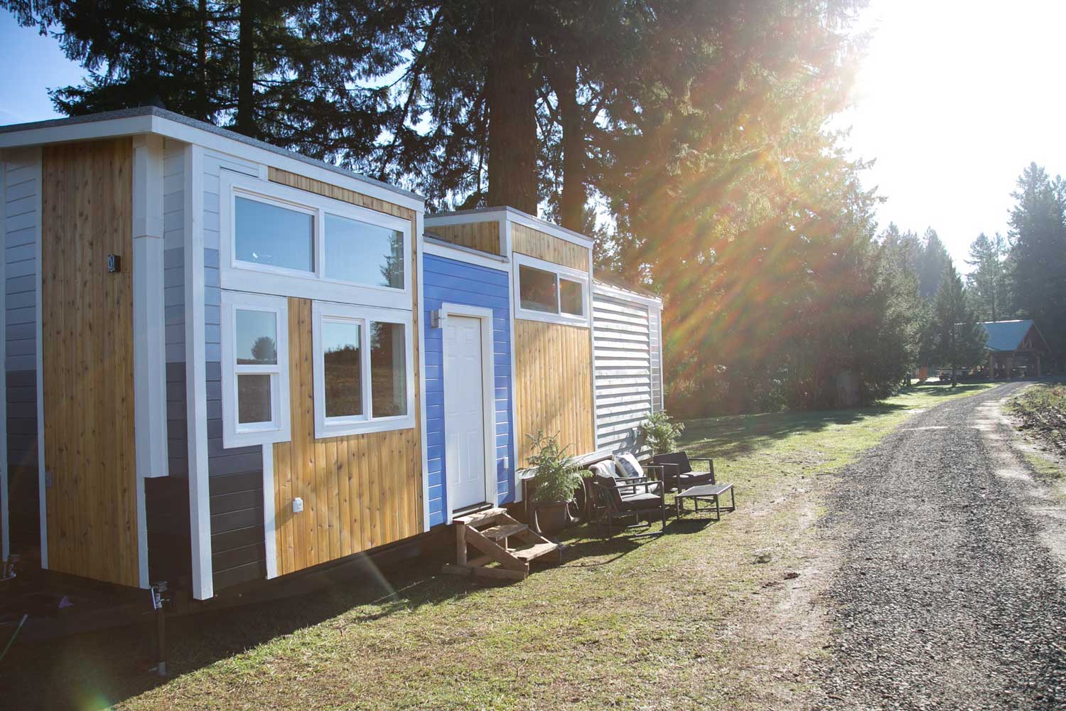 Sun drenched outside shot of the Kentucky Donut Shop custom commercial tiny home with trees in the background