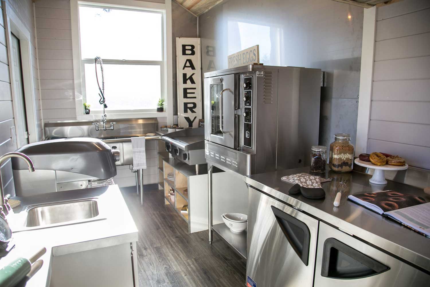 Stainless steel commercial kitchen in the Kentucky Donut Shop custom commercial tiny home