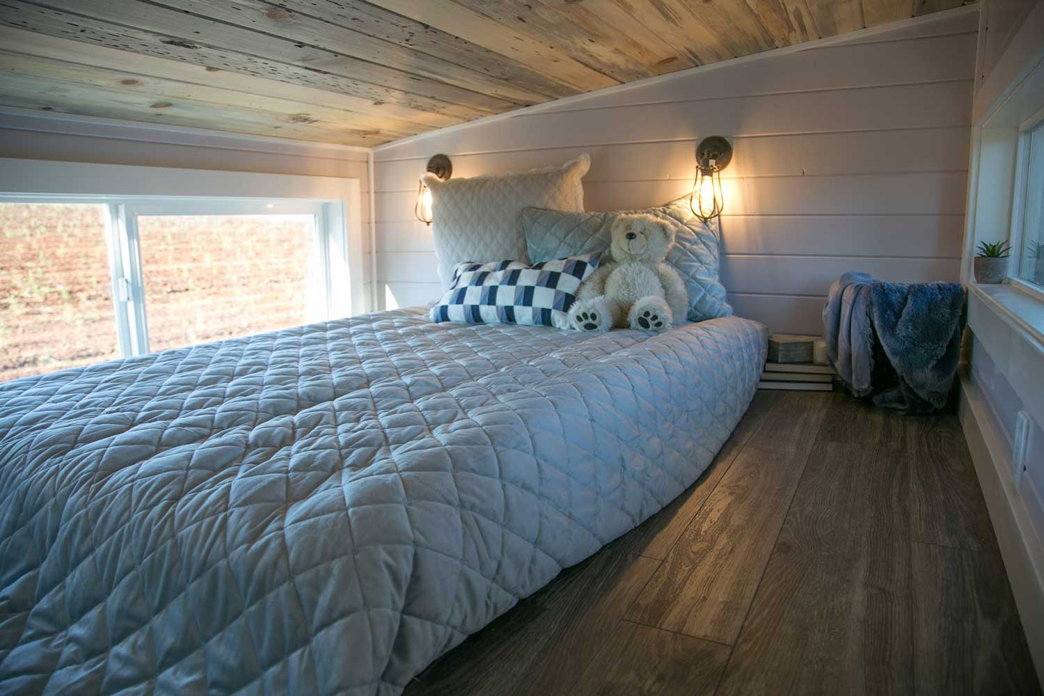 Loft bedroom in the Kentucky Donut Shop custom commercial tiny home