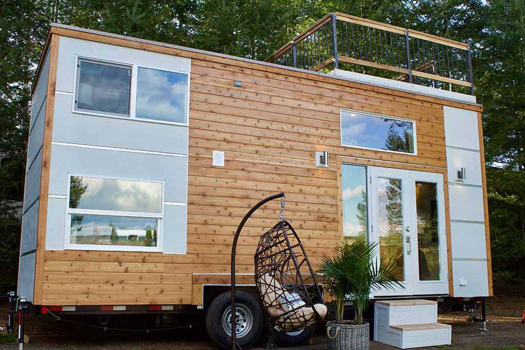 Outside of the Live / Work Tiny Home with swing