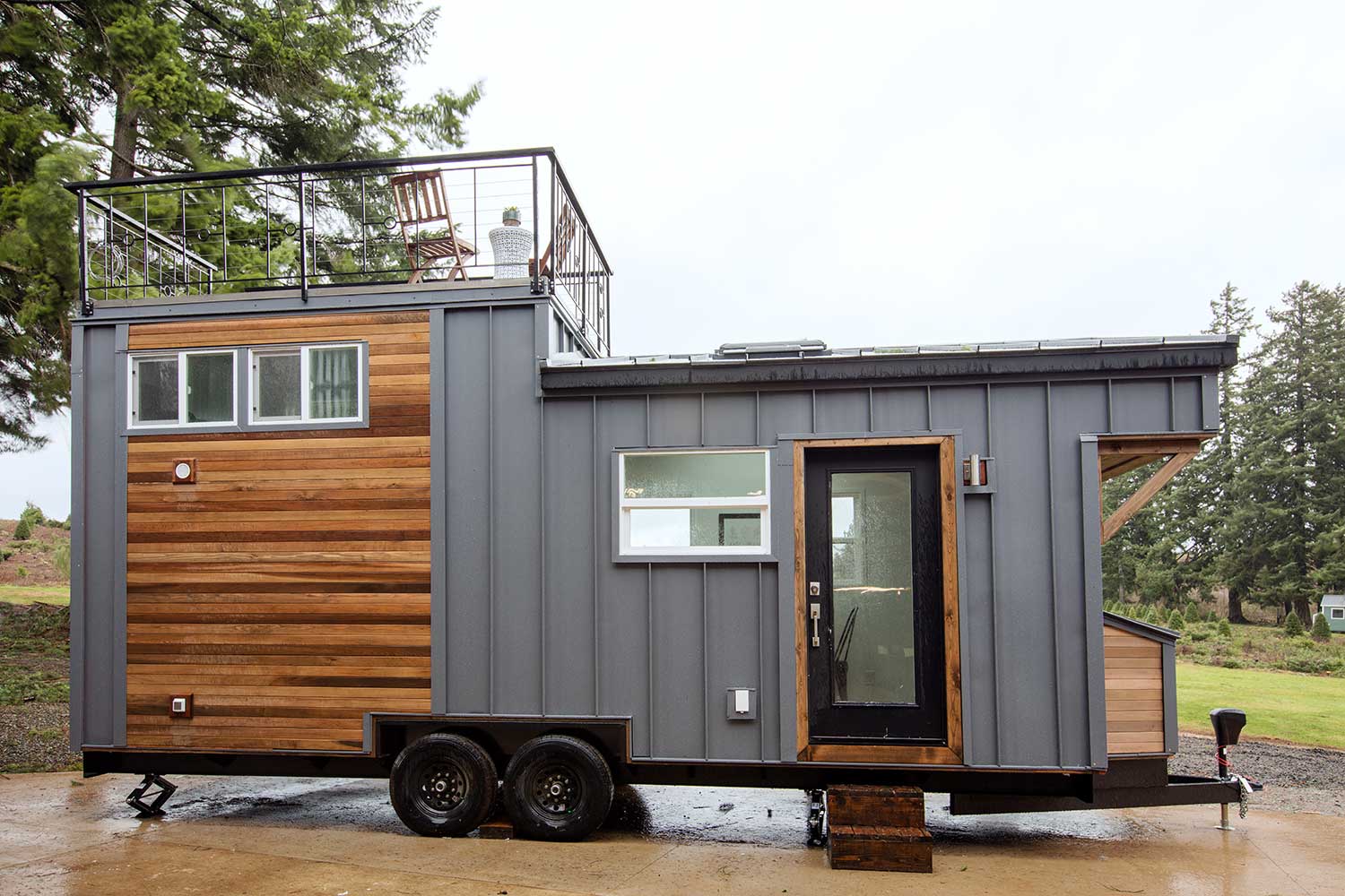 Outside view of the Midcentury Modern Tiny Home showing its roof deck