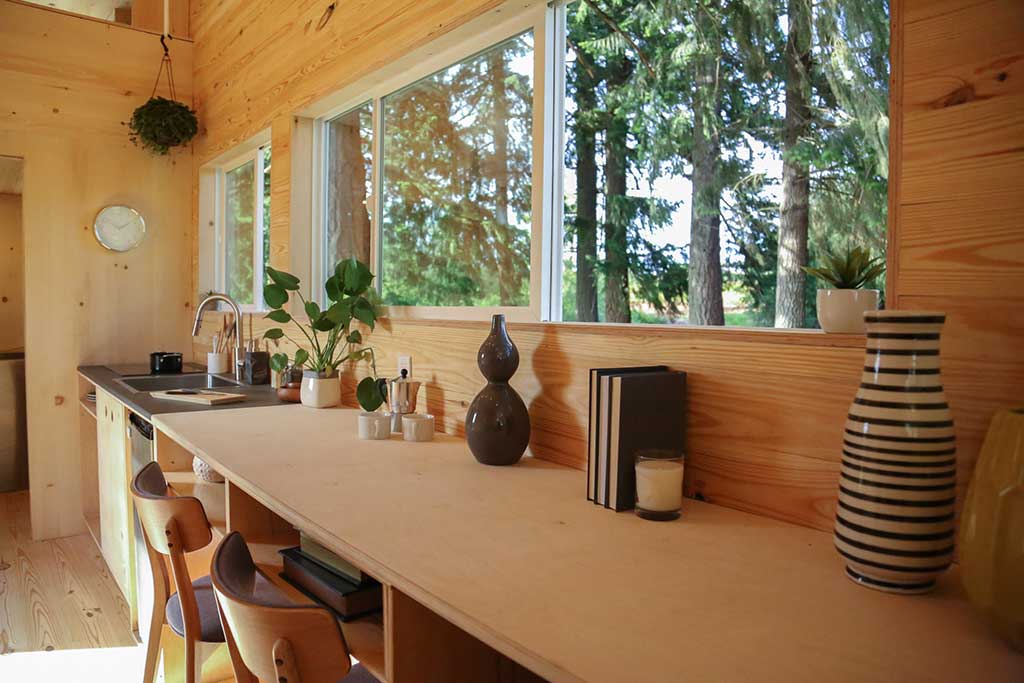 Detail of decorations and window in TIny Heirloom's odern Shou Sugi Ban custom tiny home