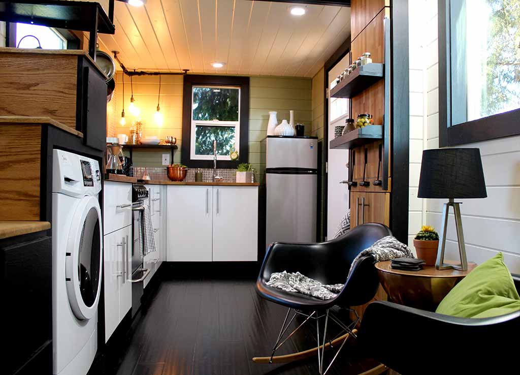 Interior of the Modern Tiny Home in Colorado showing kitchen and sitting area