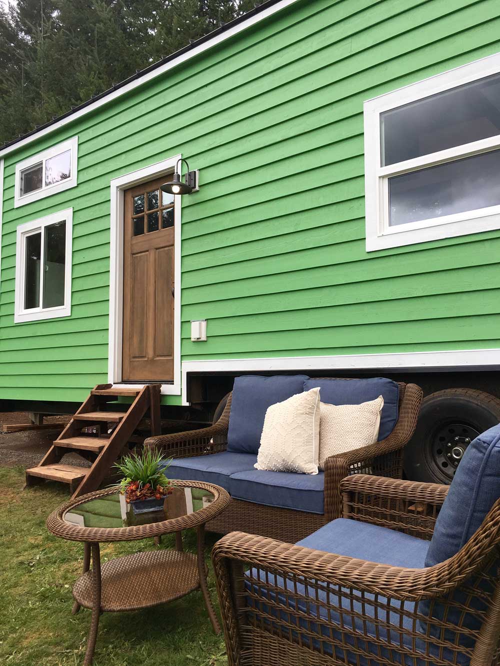 Outside details of the Retro Southern Charm custom tiny house showing patio furniture