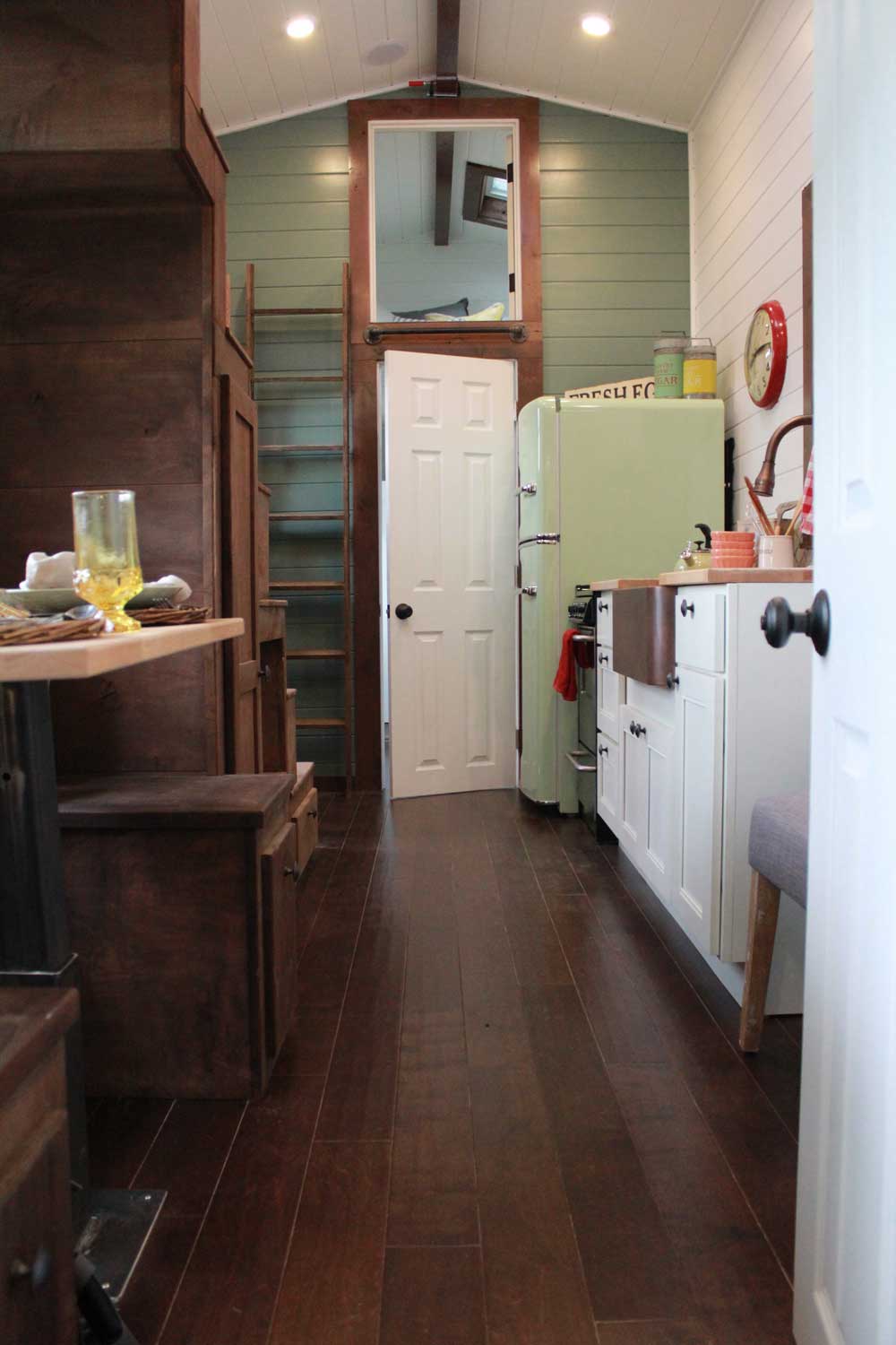 Interior of the Retro Southern Charm custom tiny house with kitchen and dining counter