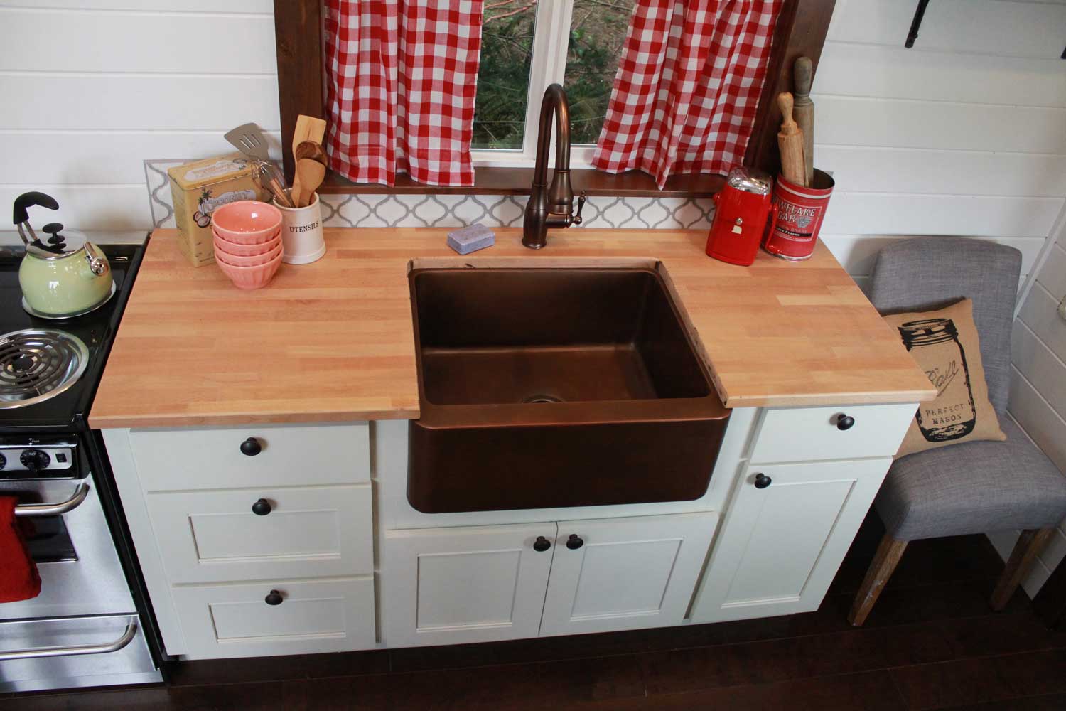 Kitchen counter and sink in the Retro Southern Charm custom tiny house