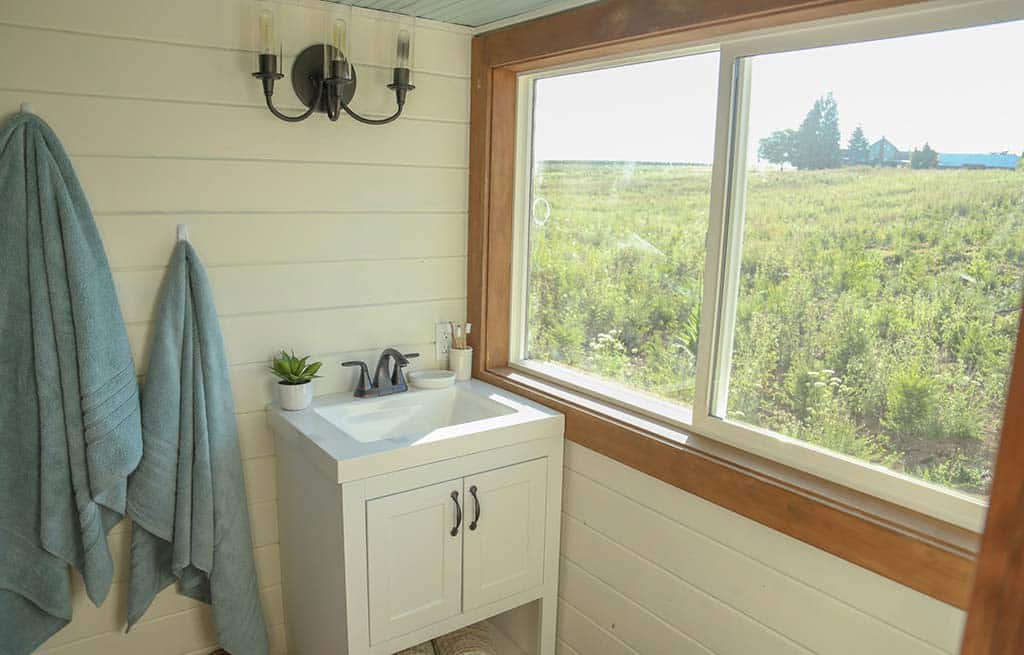 The bathroom sink in the Rustic Farmhouse custom tiny home