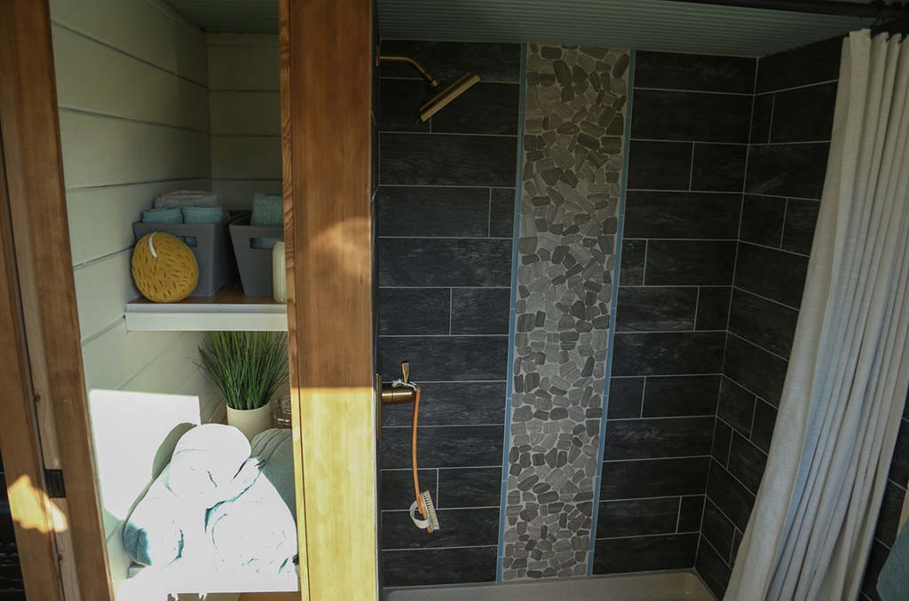 Tile shower in the Rustic Farmhouse custom tiny home