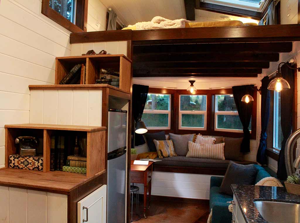 Interior of Outside of The Sapphire custom tiny house with storage stairs and couch