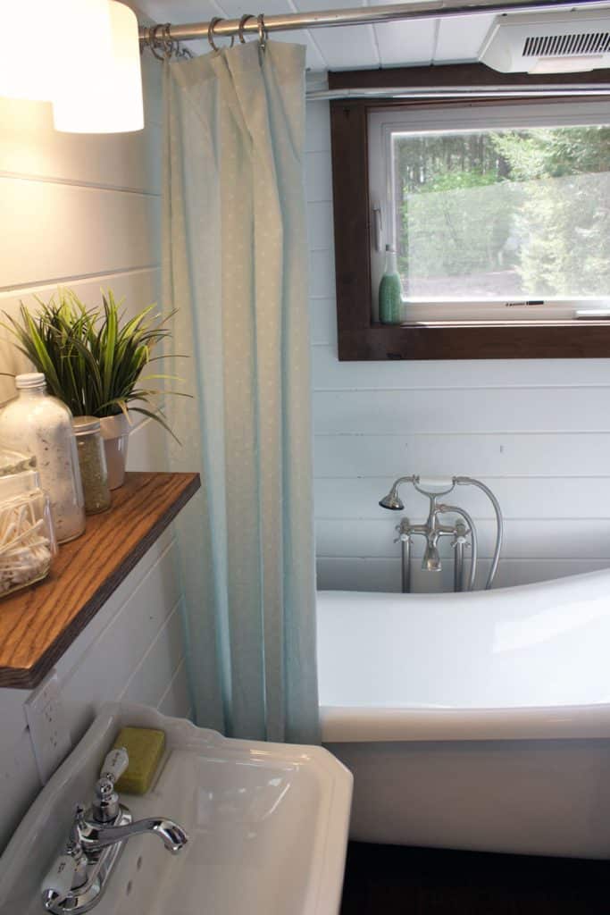 The Southern Charm custom tiny house's bathroom with tub