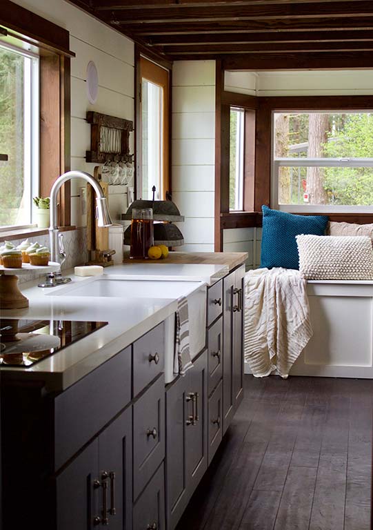 The kitchen of the The Tailgating Farmhouse custom tiny home