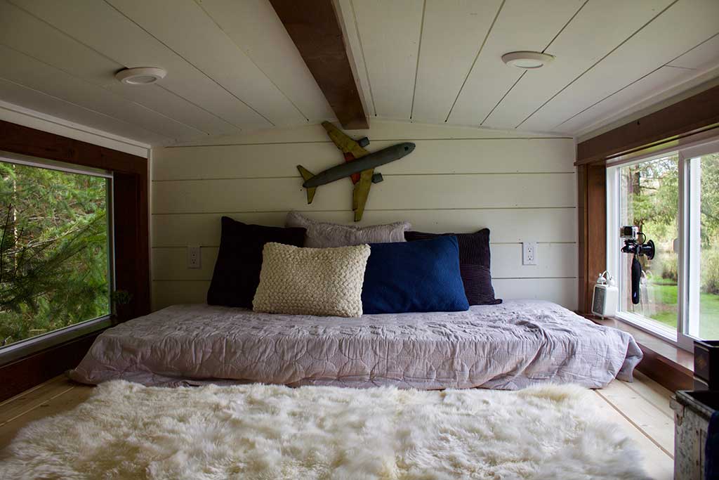 The Tailgating Farmhouse custom tiny home's loft bedroom