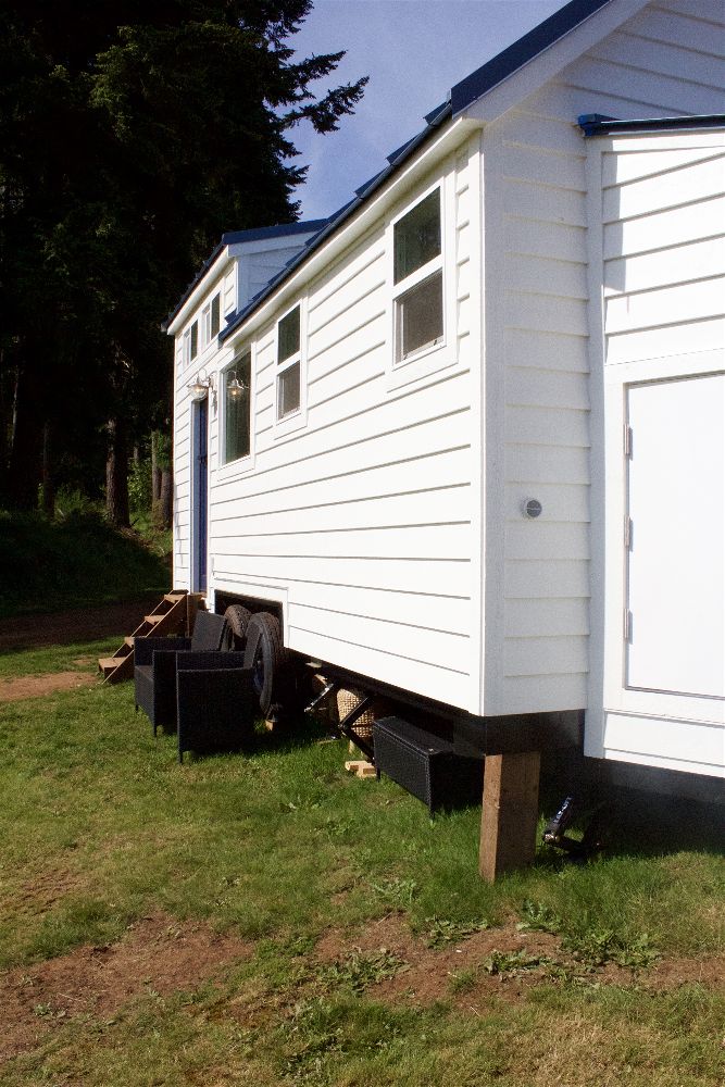 Outside of the Texan Tiny Farmhouse custom tiny home