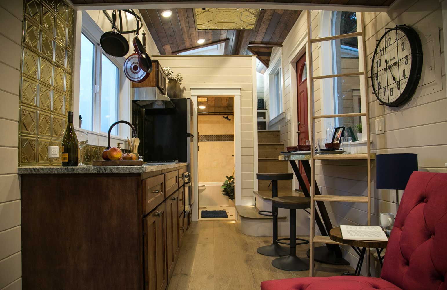 Theater Home custom tiny house's interior with kitchen and dining counter