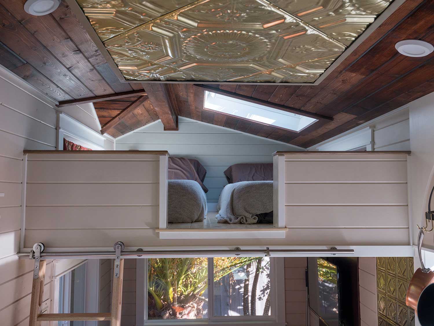 Loft and metal inlaid ceiling in the Theater Home custom tiny house