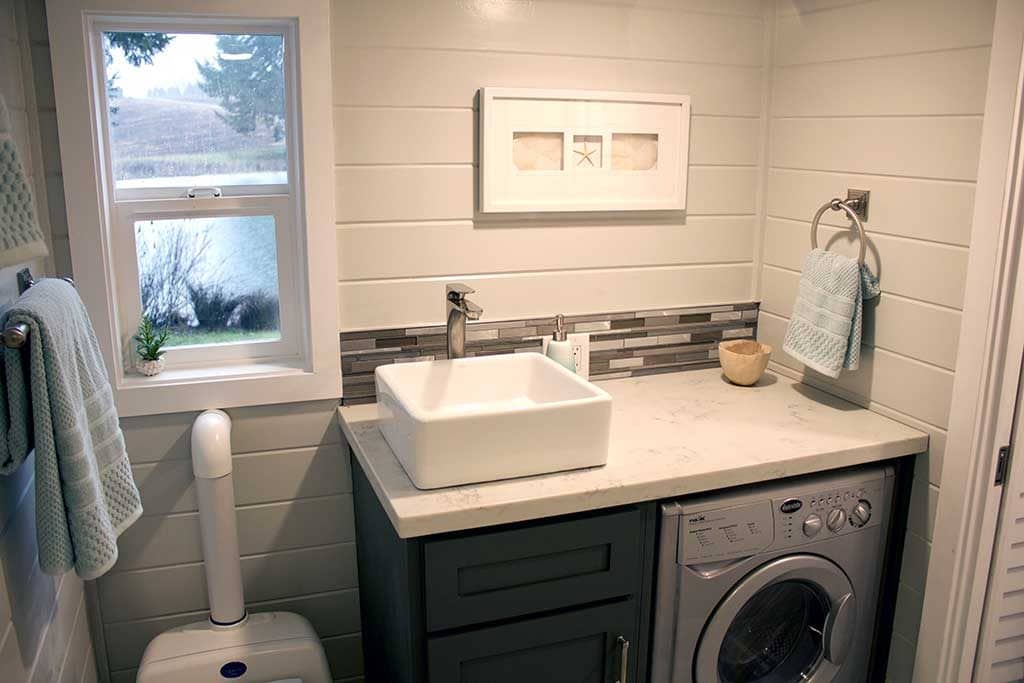 The bathroom / washer in the Tiny Beach House custom tiny house