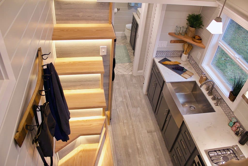 Tiny Beach House custom tiny house's custom lit stairs and kitche