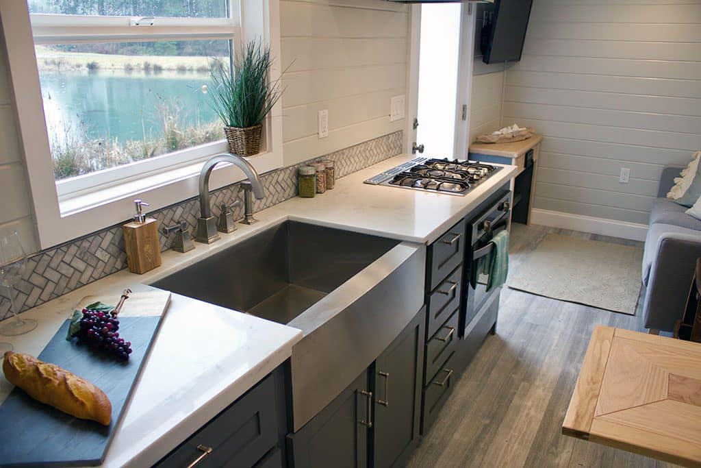 The kitchen of the Tiny Beach House custom tiny house