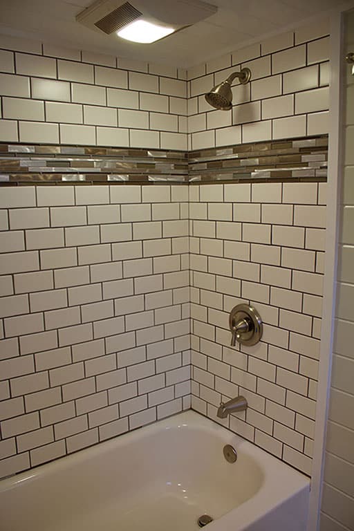 The custom tile shower in the Tiny Beach House custom tiny house