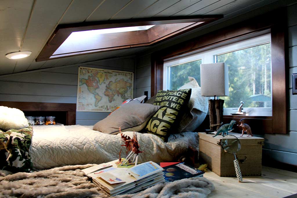 Loft bedroom in the Tiny Home, Big Family custom tiny house