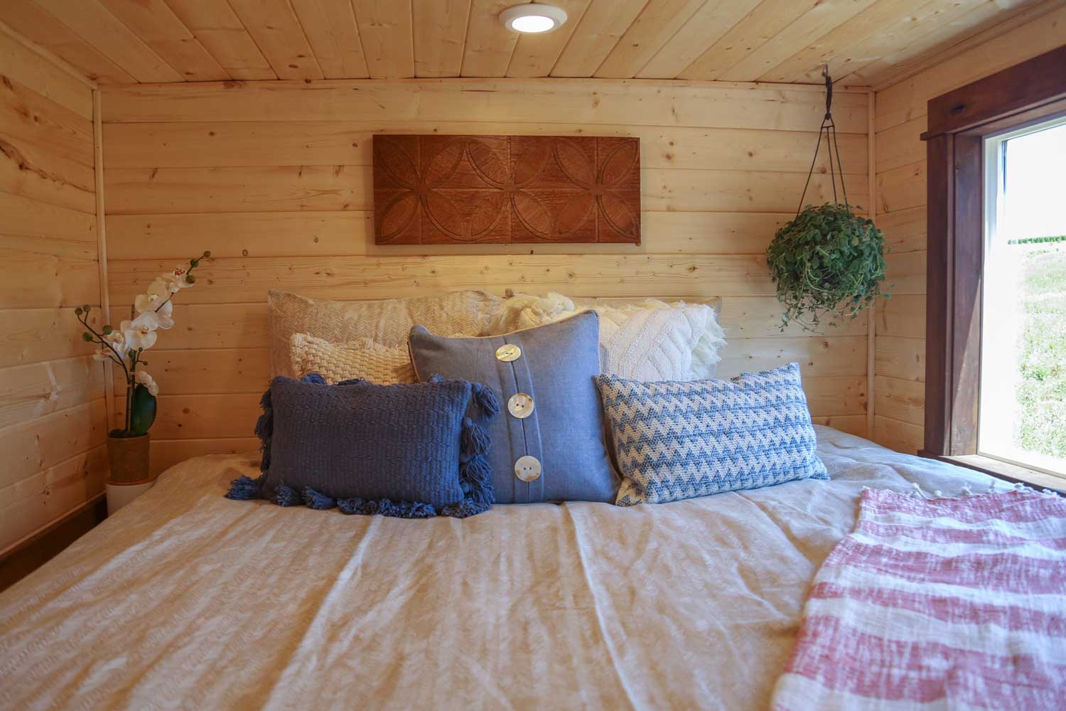 Loft bedroom in the Tropical Getaway custom tiny house
