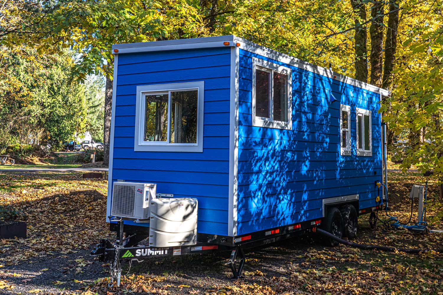 Bright blue outside of the True Blue custom tiny home