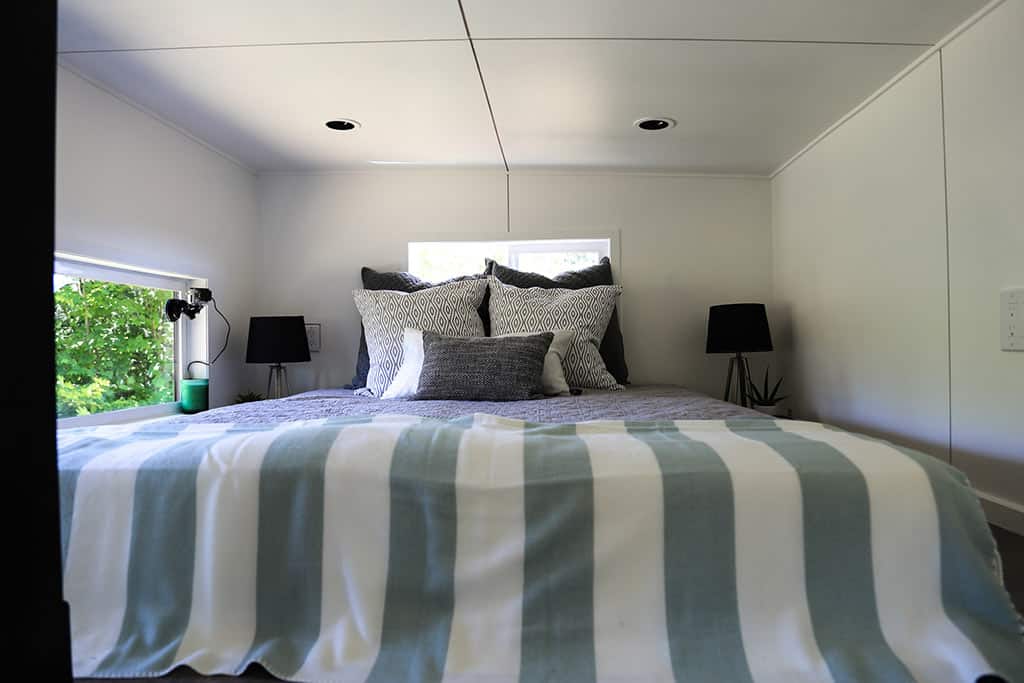 Bed in the The Ultra Modern custom tiny home