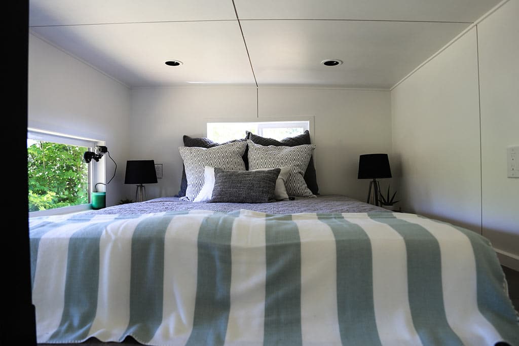 Bed in the The Ultra Modern custom tiny home