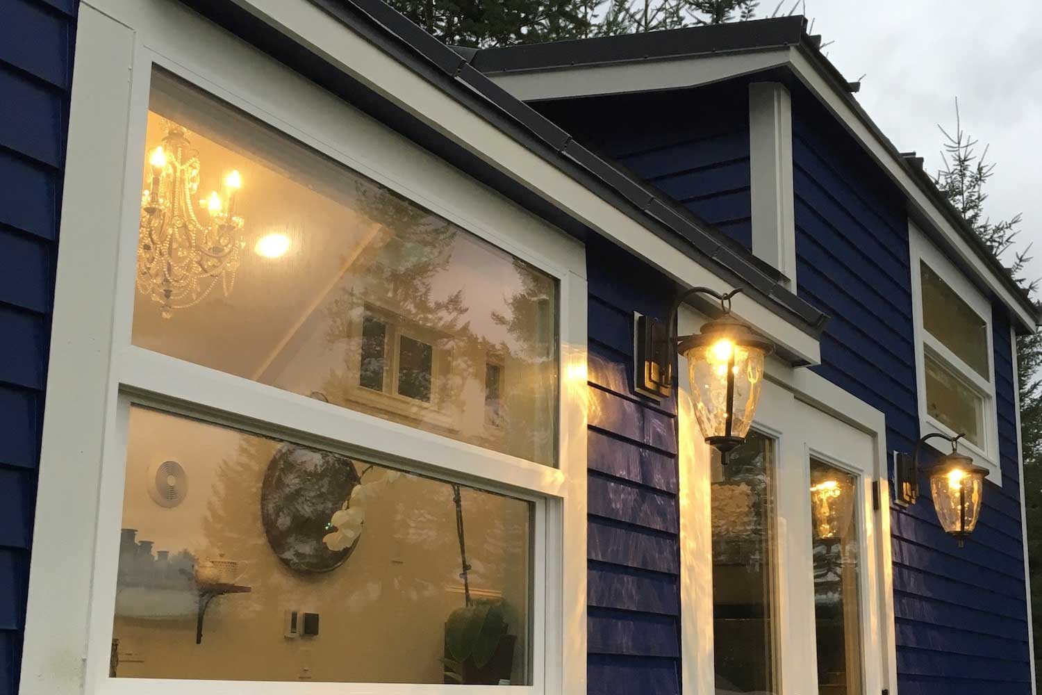 Outside detail of big windows in the Vintage Glam custom tiny home