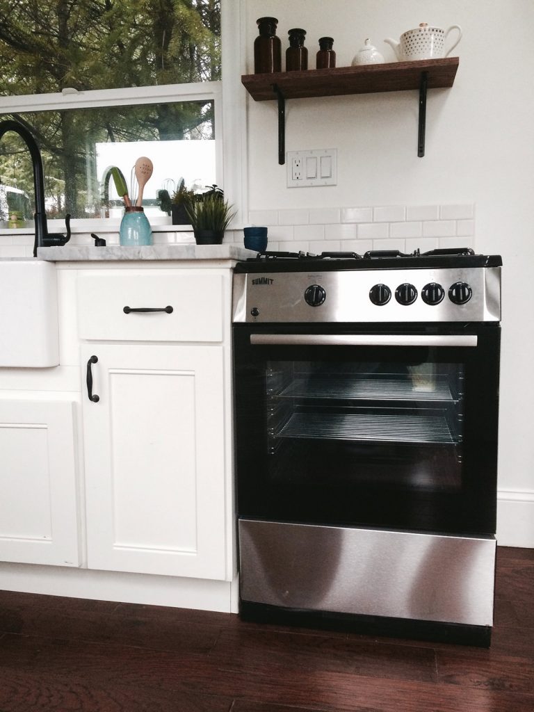 Kitchen of the Vintage Glam custom tiny home