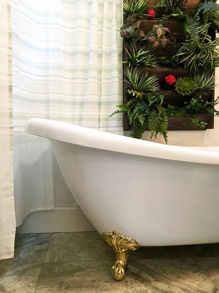 Vintage Glam custom tiny home's bathrub