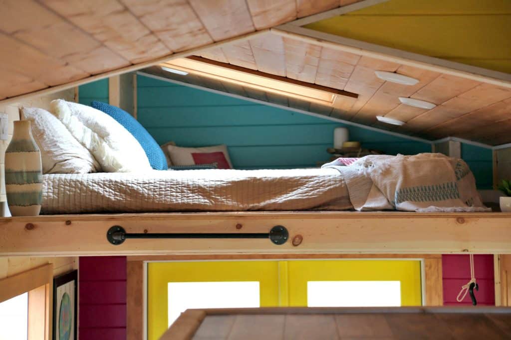 Sleeping loft in the Beachy Bohemian custom tiny home