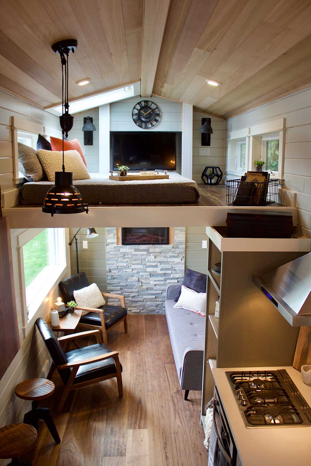 Interior of the Modern Mountain House custom tiny house showing loft and living room