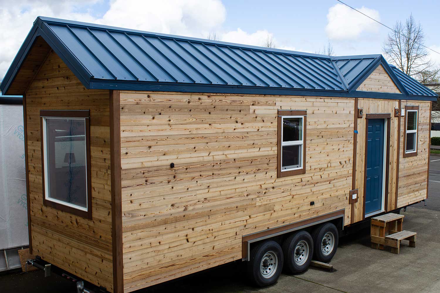 Wood siding and room on the Pioneer custom tiny home