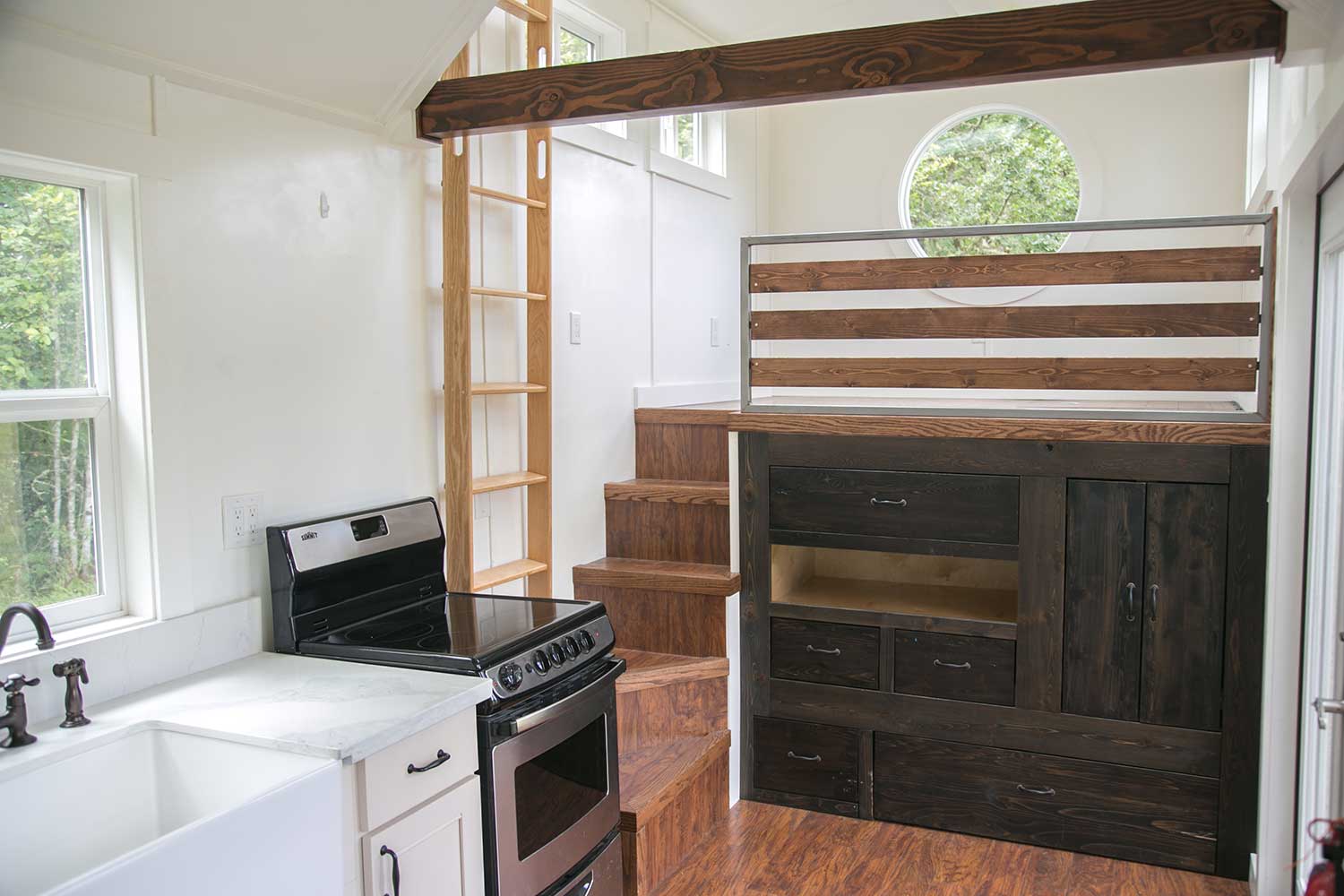 Kichen and loft in the Maribelle Blue custom tiny home