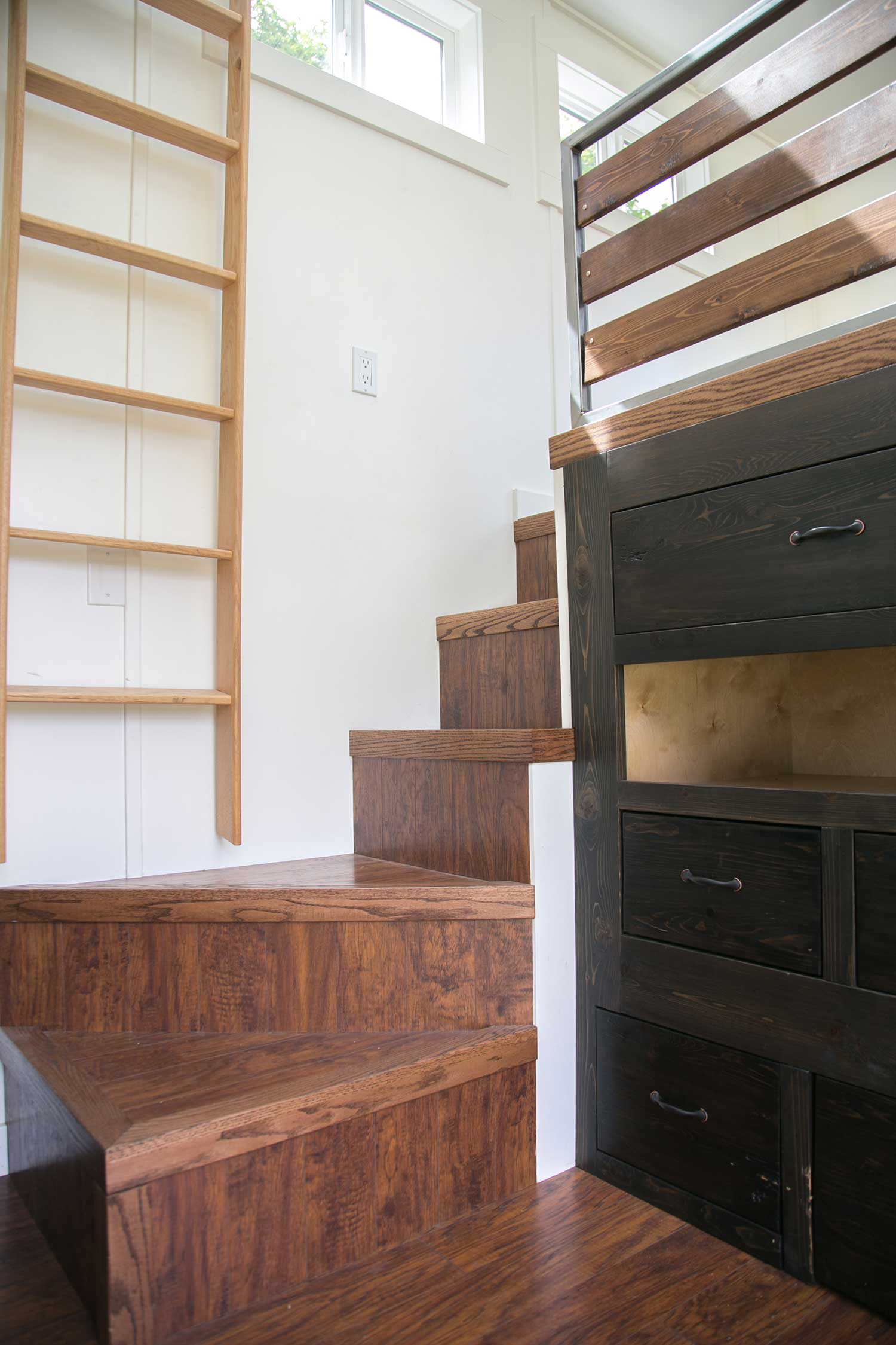 Detail of the stairs to the loft in the Maribelle Blue custom tiny home