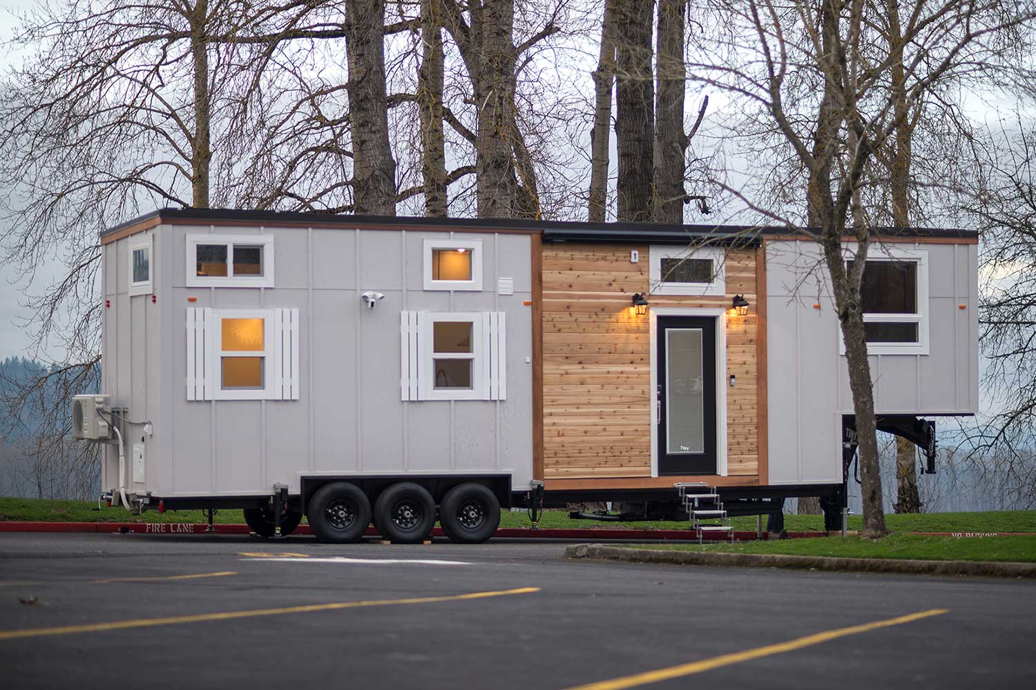 The Kingston custom tiny house - outside shot with trees in the background
