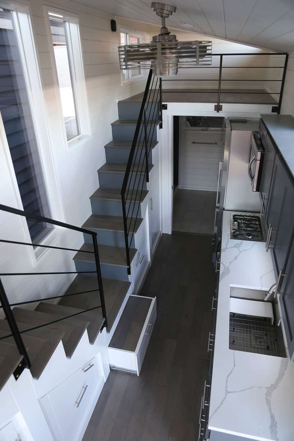 Stairways to lofts in the Contempo custom tiny home