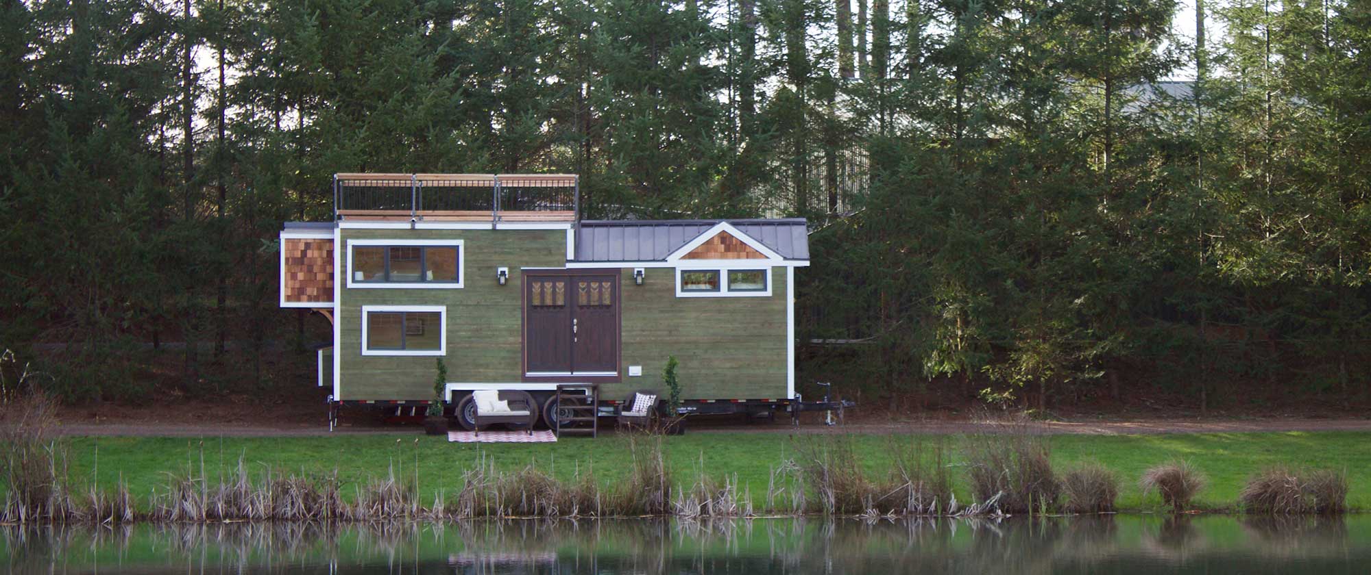 A lovely craftsman tiny house situated by a lake