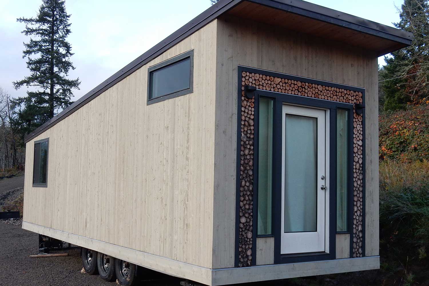 Outside of the Log Cabin custom tiny home by