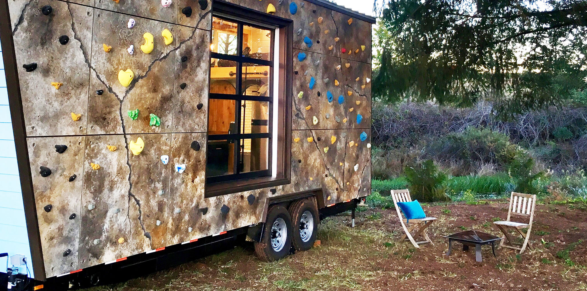 Climbing wall on the outside on an adventurous tiny home featured on our Tiny Home TV show
